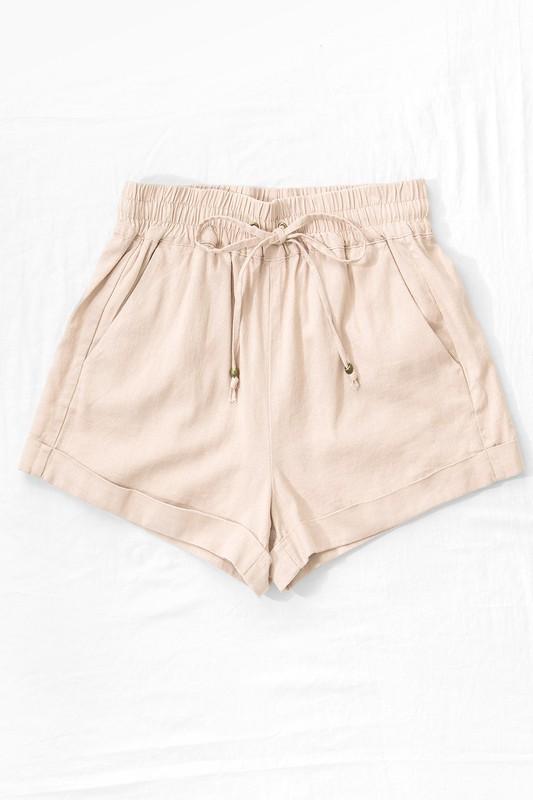 Linen Type Waistband Shorts with String Tie - Khaki - Fate & Co.There is nothing better than a pair of linen shorts to throw on in the summer. Our Daydream Linen shorts feature a relaxed fit, pull on elastic waistband, adjustable string tie and are available in multiple colors! Pair with a classic white tank or tee for an effortless summer look!  Color: Khaki  55% Linen 45% Viscose
