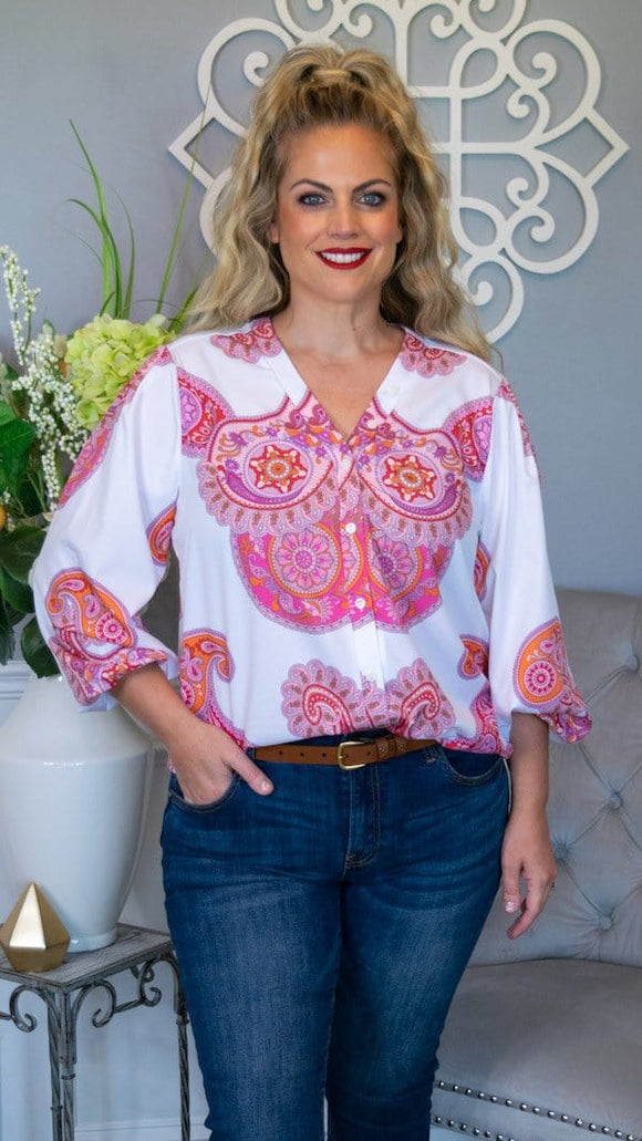 Colors that will make you smile and style that is on point! Show up to your next girls night out rocking this beautiful and bold boho blouse. Featuring a relaxed and flowy fit, full button down front, 3/4 length sleeve with elastic wrist for a blousing effect , this top is a perfect pairing with any denim bottoms and wedges!   Color: White/Red/Pink/Orange mix 