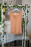 Back to Basic Henley Four Button Tank - Ginger - Fate & Co. We are going back to basics! We love how effortlessly versatile our Four Button Henley tank is. Featuring a fitted silhouette, four button front, contrast stitching and exposed detail, this tank is the perfect layering piece under your favorite cardigan, or it look great alone! Pair it with your favorite bottoms and bralette for a comfortable and casual look!   Color: Ginger  60% Polyester 32% Cotton 8% Spandex