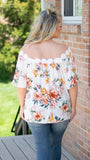 Close to Me Floral Print Blouse w/Flower Trim Detail Top - Fate & Co. This floral print blouse is a must have for summer nights! Featuring a detailed floral trim neckline that can be worn on or off the shoulder, short bell sleeve and stunning bright floral pattern, this top is sure to turn heads. We love this blouse paired with dark wash denim jeans and neutral wedges.   100% Cotton  Color: White with Floral Pattern