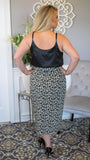 Call of the Wild Soft Leopard Print Wrap Skirt - Fate & Co. Show off your wild side this season with this fun, comfortable wrap skirt. You'll love the mid-calf length and authentic animal print on this easy-to-wear piece. The thick waistband with bow tie is slimming and gives just the right amount of coverage for those days you're feeling bolder than usual. It's perfect to wear with any blouse or t-shirt in your wardrobe, matched with your favorite pumps! 