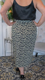 Call of the Wild Soft Leopard Print Wrap Skirt - Fate & Co. Show off your wild side this season with this fun, comfortable wrap skirt. You'll love the mid-calf length and authentic animal print on this easy-to-wear piece. The thick waistband with bow tie is slimming and gives just the right amount of coverage for those days you're feeling bolder than usual. It's perfect to wear with any blouse or t-shirt in your wardrobe, matched with your favorite pumps! 