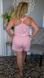 Dare to Dream Blushed and Bunched Romper - Fate & Co. If you're looking for a flirty and feminine look for any summer occasion, then this sweet pink romper is the perfect choice. It's relaxed, loose fit will give you plenty of room to move, and the straps are thin so they won't bind around your shoulders as move about your day! The drawstrings on the waist will keep things feeling nice and secure too, making sure that you'll feel comfortable at any party, summer BBQ or night out with friends.  Made in USA