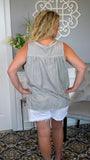 A Walk to Remember Perfect Pull-Over Grey Button Tank 6/18 - Fate & Co.This pull-over grey button tank is perfect for when you want to look fashionable and ultra comfortable all at one time. With a loose fitting design and distressed look on soft grey washed fabric, this versatile tank will be your new summertime favorite! Wear it with jeans or shorts. Undo the top three snaps to show off the lace pattern of your favorite bralette for added layer of texture and style.  Color: Distressed Grey