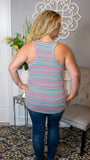 This bright and beautiful racerback tank is sure to pop some color into your day! Featuring a relaxed fit, v-neckline, multicolor stripe, slouchy chest pocket and curved hem, this tank says comfort and style all at once! We love this tank paired with our Jessica dark wash mid-rise denim jeans and a pair of sandals!   Made in USA  65% Polyester 30% Rayon 5% Spandex