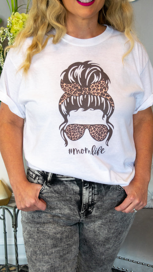 #momlife... need we say more? Messy Buns , Leopard Print and Shades are all we need to survive the crazy days of mom-ing! This graphic tee features a vintage look with sublimination printing AND.... There is a match #kidlife tee available to match your little one! 