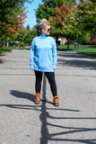 Ultra soft knitted fabric shapes this super buttery sweater that features a mock neckline, one buttoned shoulder, long sleeves and a relaxed bodice. Ribbed detail accents the neckline, cuffs and hem for added texture to the top. Pair with your favorite denim or leggings and booties for a perfect cozy and comfortable look.  Color: Blue 