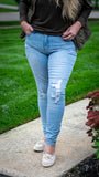 Wanna better bootie? Look no further thank our Lennox perfect lift skinnies! Featuring a traditional stitched hem, light whiskering and destruction on front, classic five pocket construction, single button closure with zipper, iconic wanna better butt fit for the perfect lift, and belt loops.   99% Cotton , 1% Spandex  Color: Distressed Light Wash