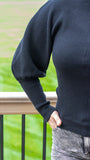 Fall in love with our classy and ultra-chic black mock neck sweater! Featuring a soft knit ribbed fabric, dramatic balloon sleeve, mock neck and lightweight feel, this semi-fitted sweater is super flirty and super trendy! Pair this top with a variety of denim bottoms and some booties for a perfect casual chic outfit!  Color: Black