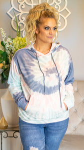 Chill out and stay cozy in this fun and funky tie-dye hooded pullover. Featuring a beautiful multicolor tie-dye pattern, drawstring hood and kangaroo pocket, this mid-weight pullover is a great go-to choice for a casual style with flare! Pair with your favorite denim or sweatpants for the perfect comfy casual look!   Color: Blue/Grey/Pink Tie-Dye