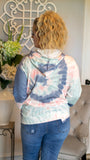 Chill out and stay cozy in this fun and funky tie-dye hooded pullover. Featuring a beautiful multicolor tie-dye pattern, drawstring hood and kangaroo pocket, this mid-weight pullover is a great go-to choice for a casual style with flare! Pair with your favorite denim or sweatpants for the perfect comfy casual look!   Color: Blue/Grey/Pink Tie-Dye