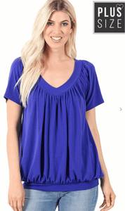 Plus V-Neck Short Sleeve Shirring Top + 5/28 - Fate & Co. Nothing says Spring/Summer than that perfect short sleeve shirring top! This playful shirring top features a stunning royal blue color, v-neckline and yoga band waist that lets you pull down for a more form fitted look or up for a more bloused look. Pair this top with any of our curvy and confident denim or linen bottoms!  57% Polyester 38% Rayon 5% Spandex  Color: Royal Blue